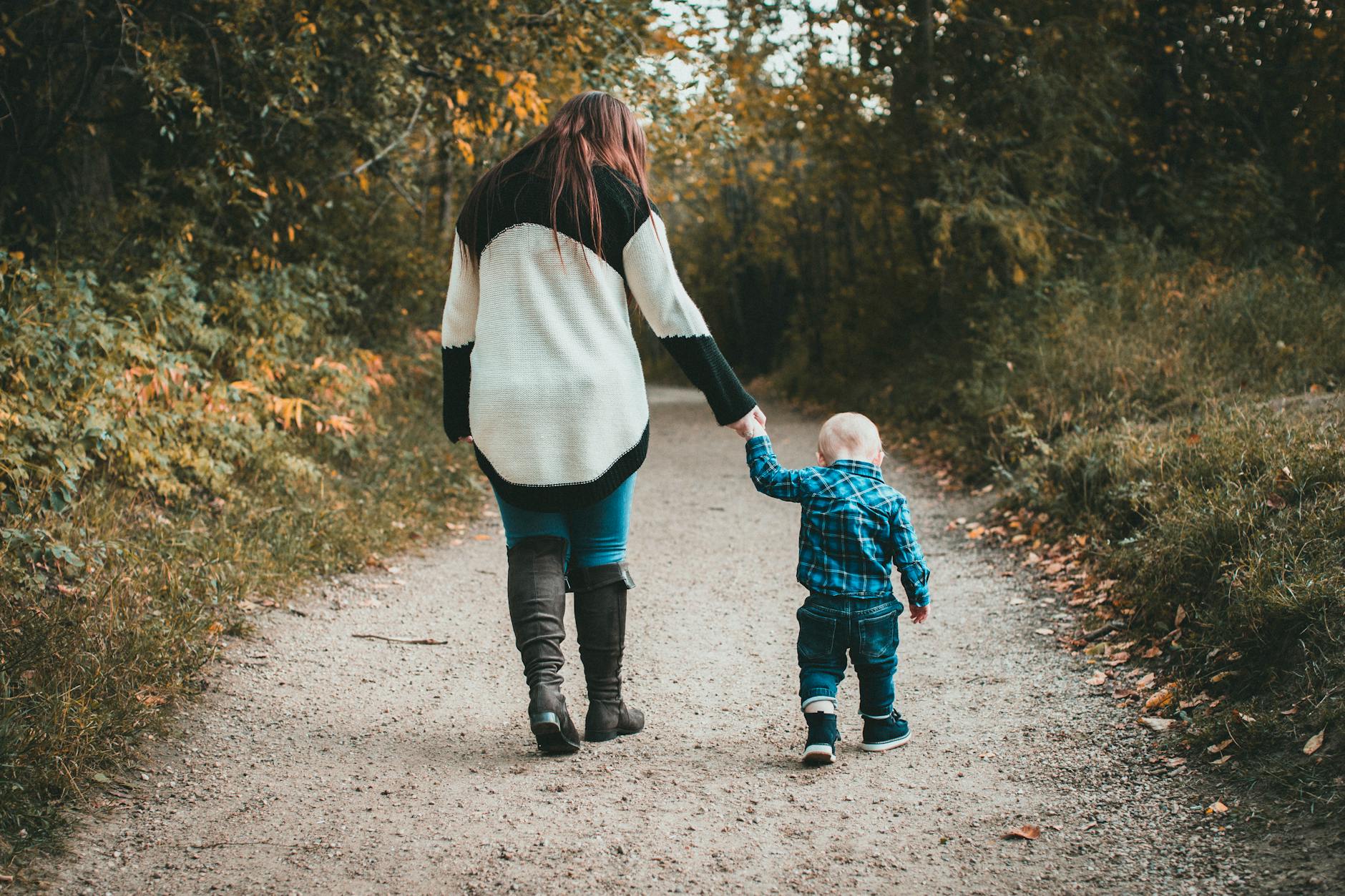 mother walking with baby son