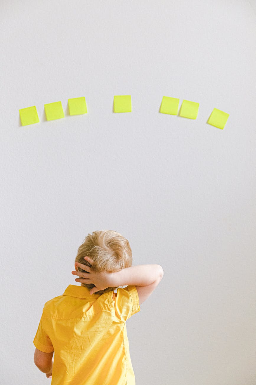 a boy in yellow shirt
