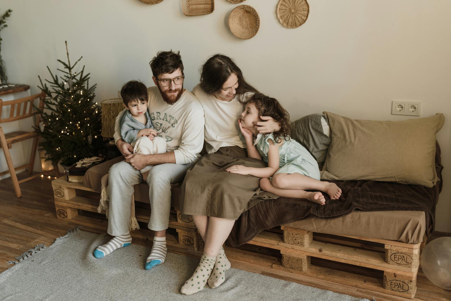family sitting on couch